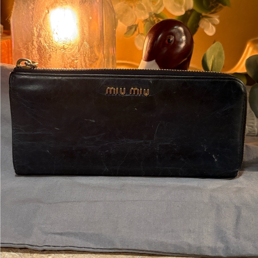 Miu miu wallet with dust bag.